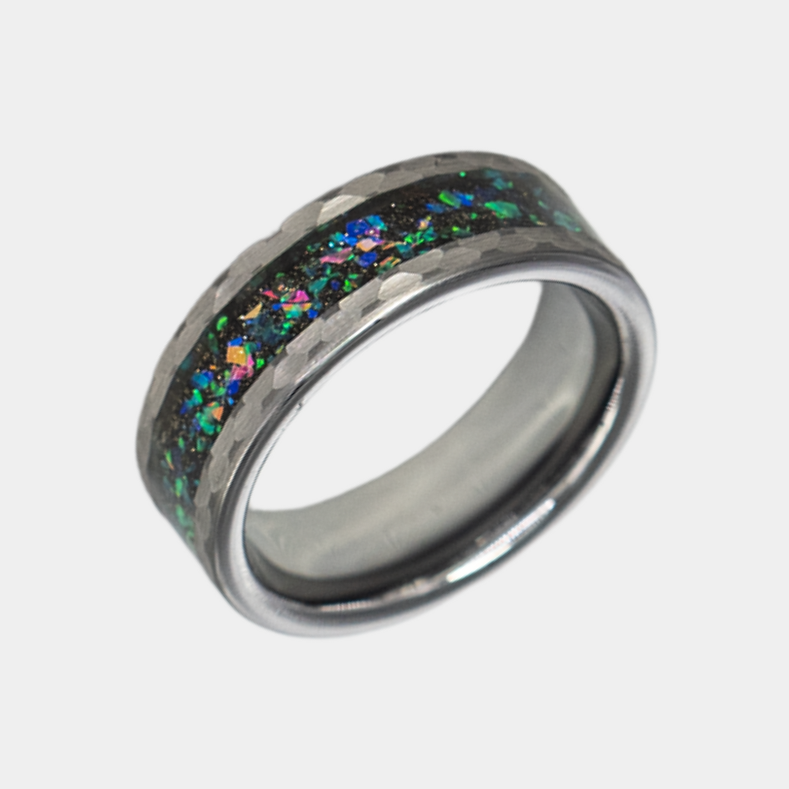 Typhon ring – Hammered Silver Tungsten featuring a Crushed Opal Inlay from the Hustler Collection. Angled view highlighting shape and finish.